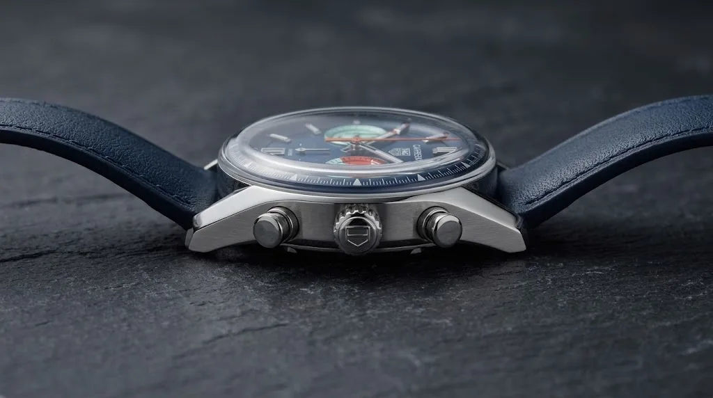 Illustrative render — reading the listing of the TAG Heuer Carrera Chronograph Skipper 39mm CBS2213.FN6002 (steel, blue dial with teal and orange counters, blue strap)