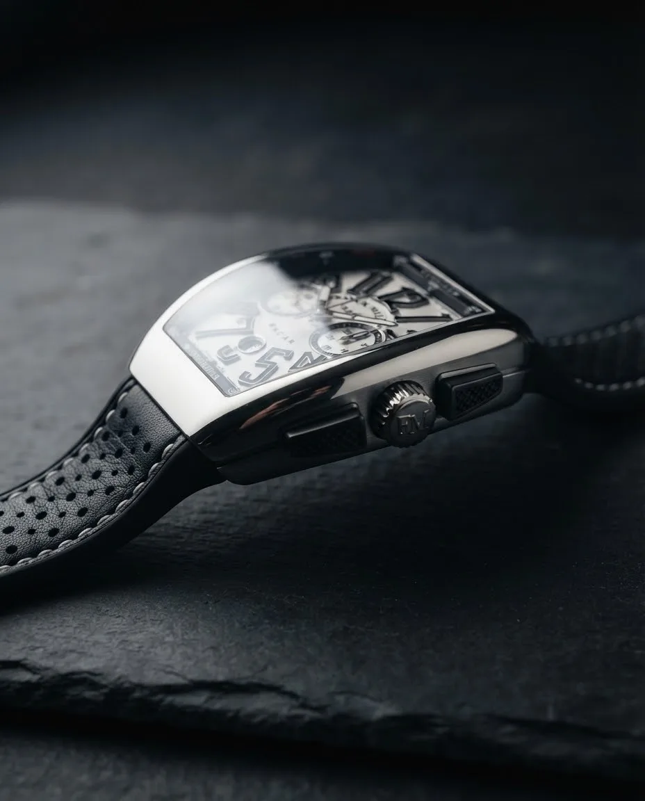 Illustrative render — reading the listing of the Franck Muller Vanguard Racing V 45 CC DT chronograph (steel, white dial, black flange, black leather-insert rubber strap)