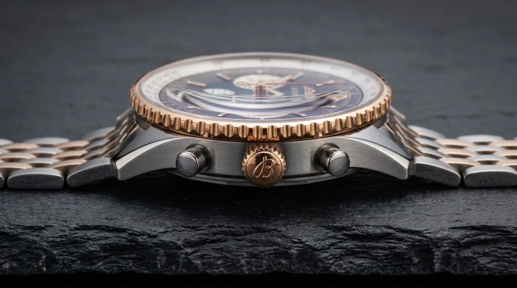 Illustrative render — reading the listing of the Breitling Navitimer B01 Chronograph 43 UB0121211F1A1 (steel and 18k red gold, black dial, steel bracelet)