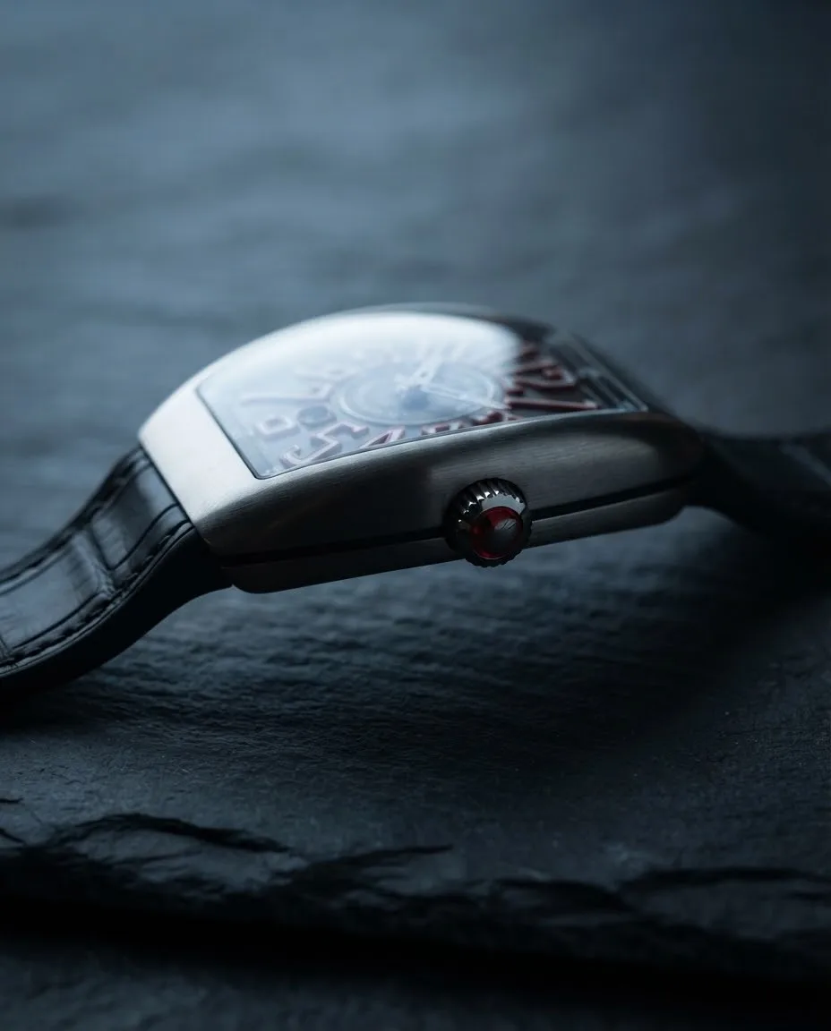 Illustrative render — reading the listing of the Franck Muller Vanguard Crazy Hours V 45 CH TT (black dial, white numerals outlined in red, black alligator-grain leather-insert strap)
