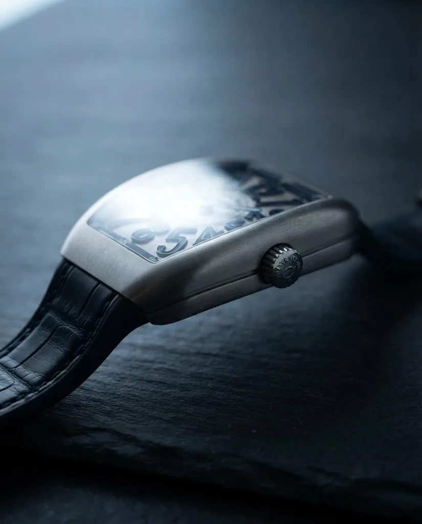 Illustrative render — reading the listing of the Franck Muller Vanguard Crazy Hours V 45 CH BR (BL) (brushed steel, blue numerals, black alligator strap with blue stitching)