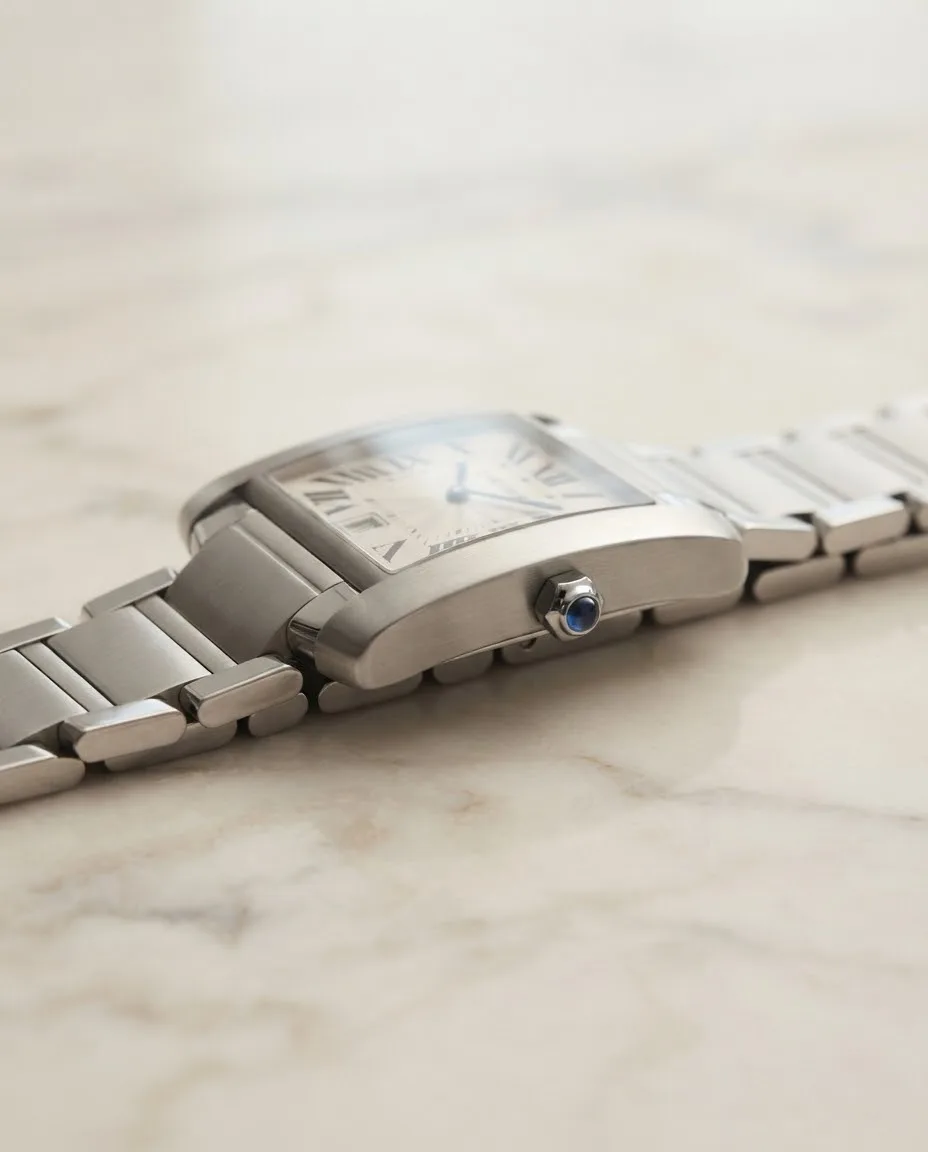 Illustrative render — reading the listing of the Cartier Tank Francaise large automatic (steel, silver dial, date, steel bracelet)