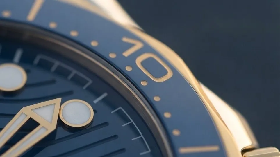 Illustrative render — yellow gold, ceragold, and why rubber of the Omega Seamaster Diver 300M Co-Axial Master Chronometer 42mm 210.22.42.20.03.001 (steel and yellow gold, blue ceramic dial, blue rubber strap)