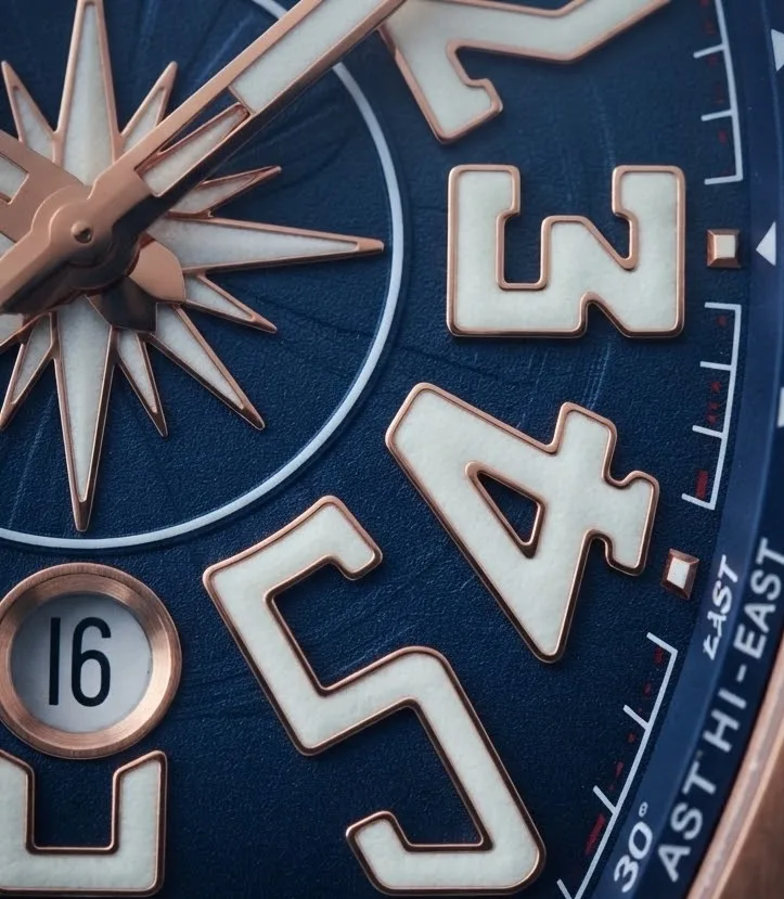 Illustrative render — yachting, on three hands of the Franck Muller Vanguard Yachting V 45 SC DT 5N.BL (18k rose gold, blue compass dial, blue rubber strap)