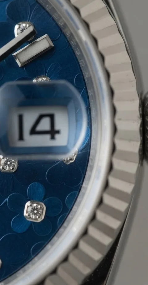 Illustrative render — why the 31 got its own dial of the Rolex Datejust 31 278274 (steel, white gold fluted bezel, blue floral dial, Jubilee)