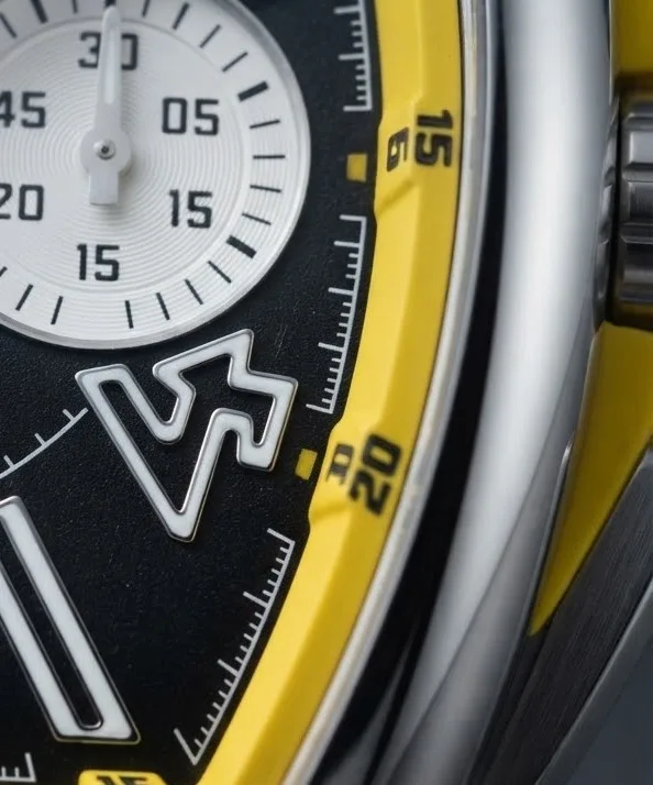 Illustrative render — yellow, and why it is there of the Franck Muller Vanguard Racing V 45 CC DT chronograph (steel, black dial, yellow flange, black leather-insert rubber strap)