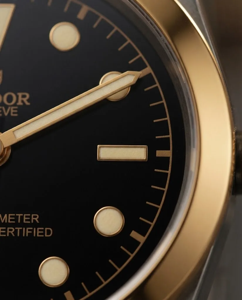Illustrative render — two-tone black bay, and what the gold is of the Tudor Black Bay 41 S&G M79683-0001 (steel and yellow gold, black dial, two-tone bracelet)