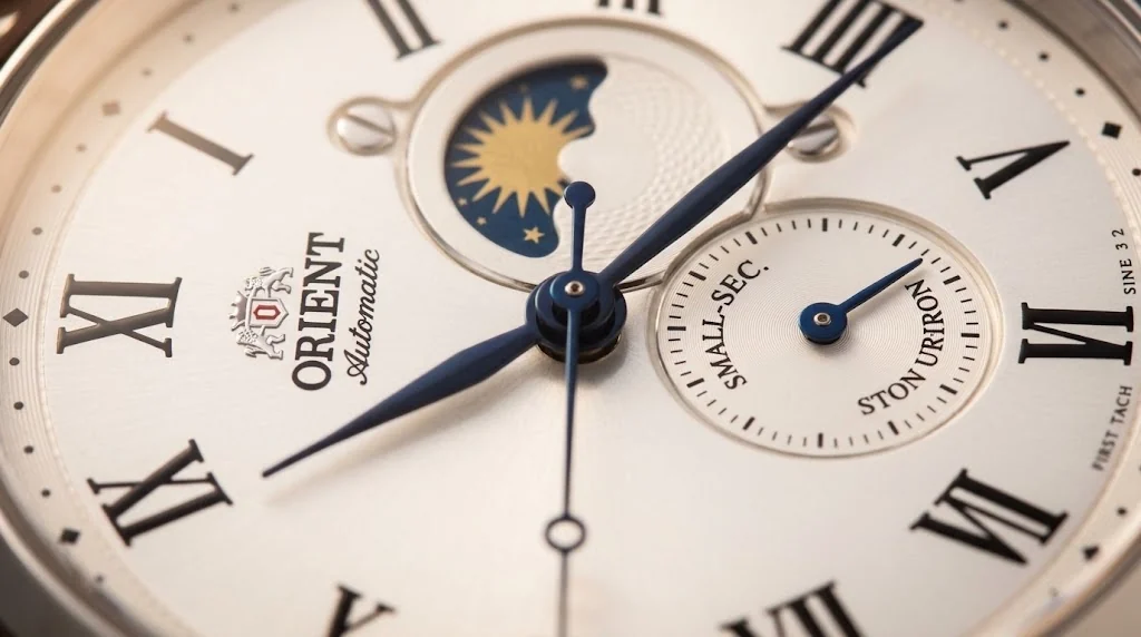 Illustrative render — the disc at twelve of the Orient Sun & Moon