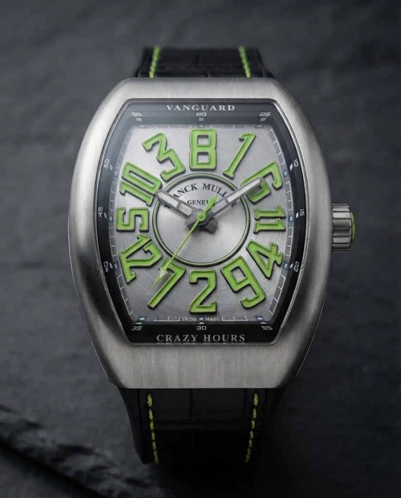 Illustrative render — hero view of the Franck Muller Vanguard Crazy Hours V 45 CH BR (green) (brushed steel, green numerals, black alligator strap with green stitching)