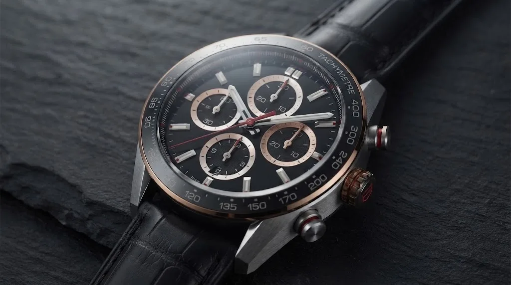 Illustrative render — hero view of the TAG Heuer Carrera Chronograph 44mm CBN2A5A.FC6481 (steel and 18k rose gold, black dial, black alligator strap, TH20-00)