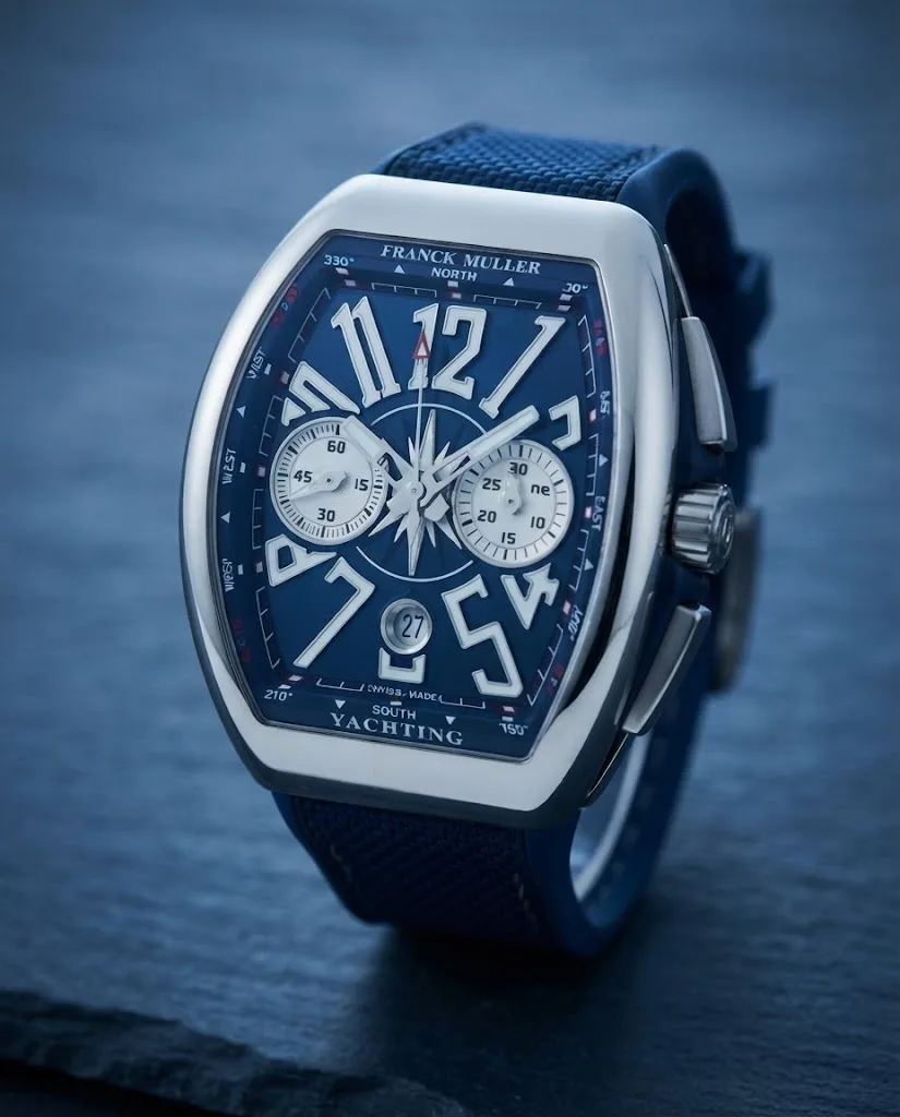 Illustrative render — hero view of the Franck Muller Vanguard Yachting V 45 CC DT AC.BL chronograph (polished steel, blue compass dial, blue rubber strap with textured top)