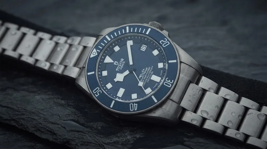 Illustrative render — hero view of the Tudor Pelagos 42mm M25600TB-0001 (titanium, blue ceramic bezel, blue dial, titanium bracelet)