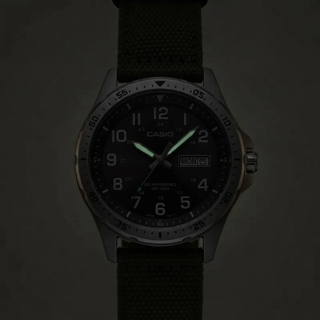Casio MTPS120L in darkness — only the two hands carry weak luminous paint