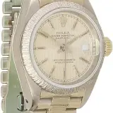 Lady-Datejust 26 ref. 69179 (18k white gold, bark-finish bezel and President bracelet, silver tapestry dial, pre-owned)